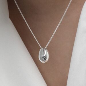 woman with nugget pendant necklace