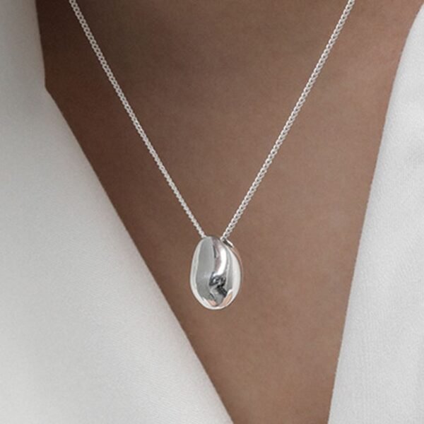 woman with nugget pendant necklace