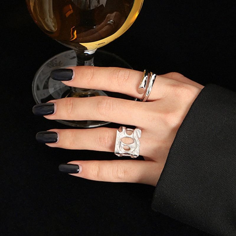 Woman hand with sterling silver rings