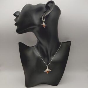 Silver Bee Amber Pendant Necklace on plastic model