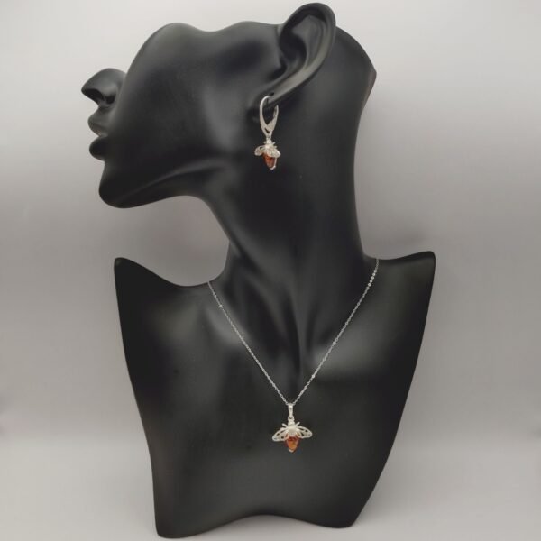 Silver Bee Amber Pendant Necklace on plastic model